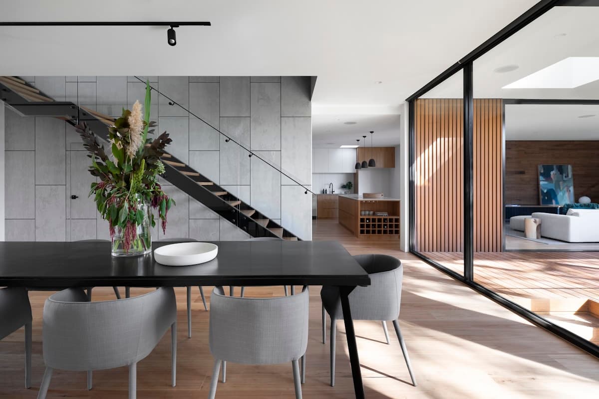 Living room with exposed brick walls and large windows